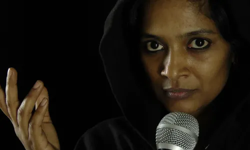 actress with microphone on stage, close up